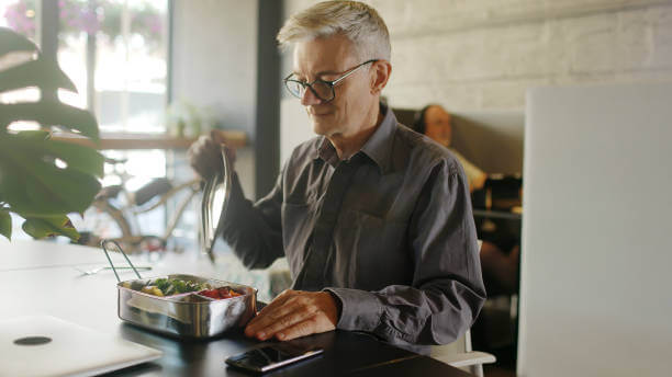 A Man Eating in the Office