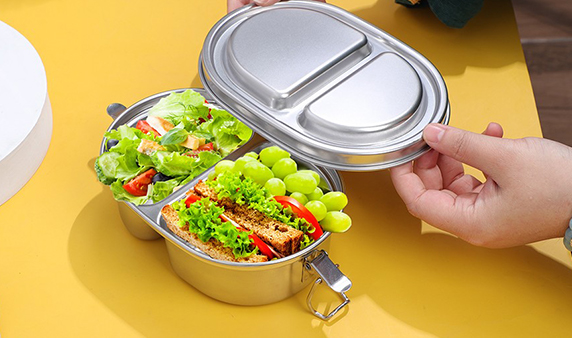 Double compartment lunch box with food