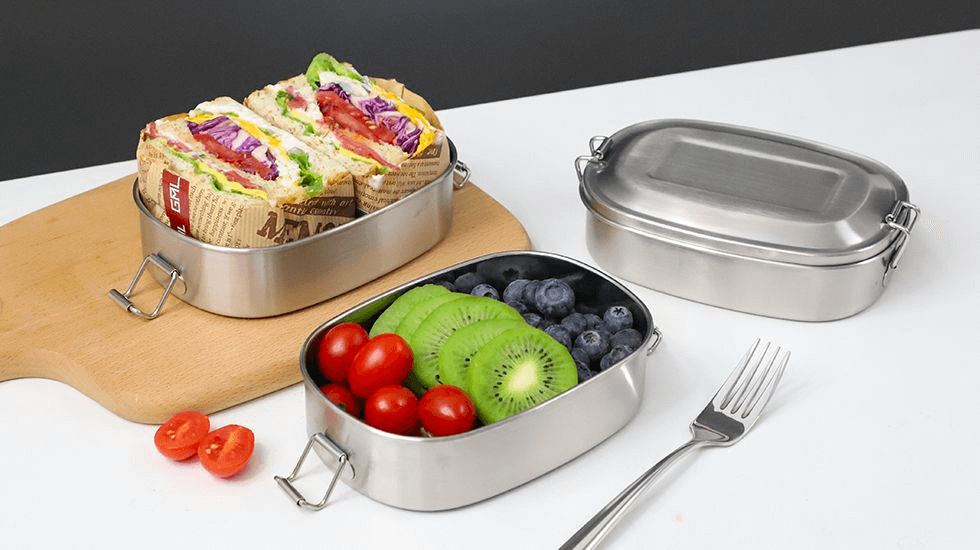 Nicety metal lunch containers with fruits and sandwich