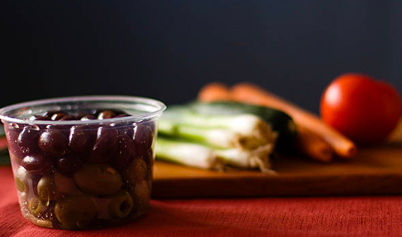 Salad ingredients in a small plastic container