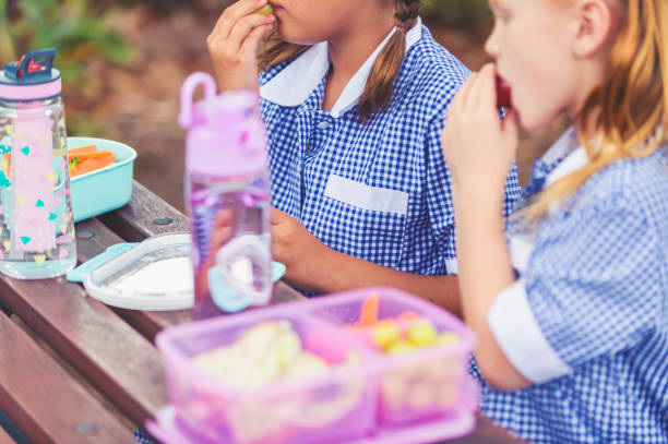 two school girls eating their lunch