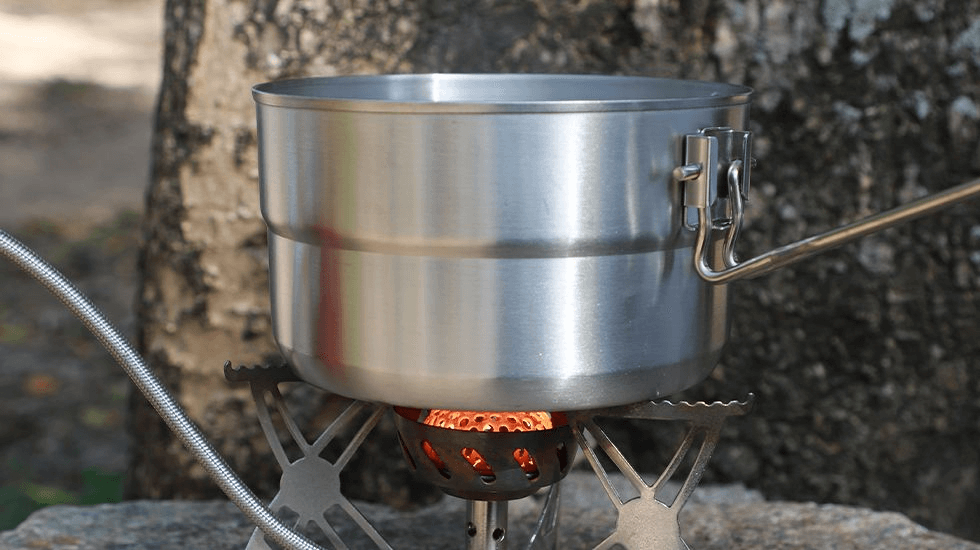 Nicety Stainless steel camping pot on open fire