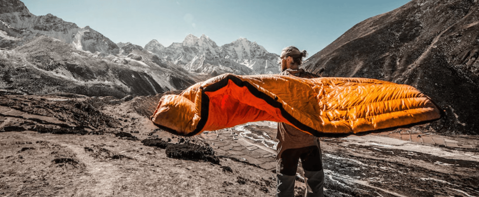 a person using a sleeping bag