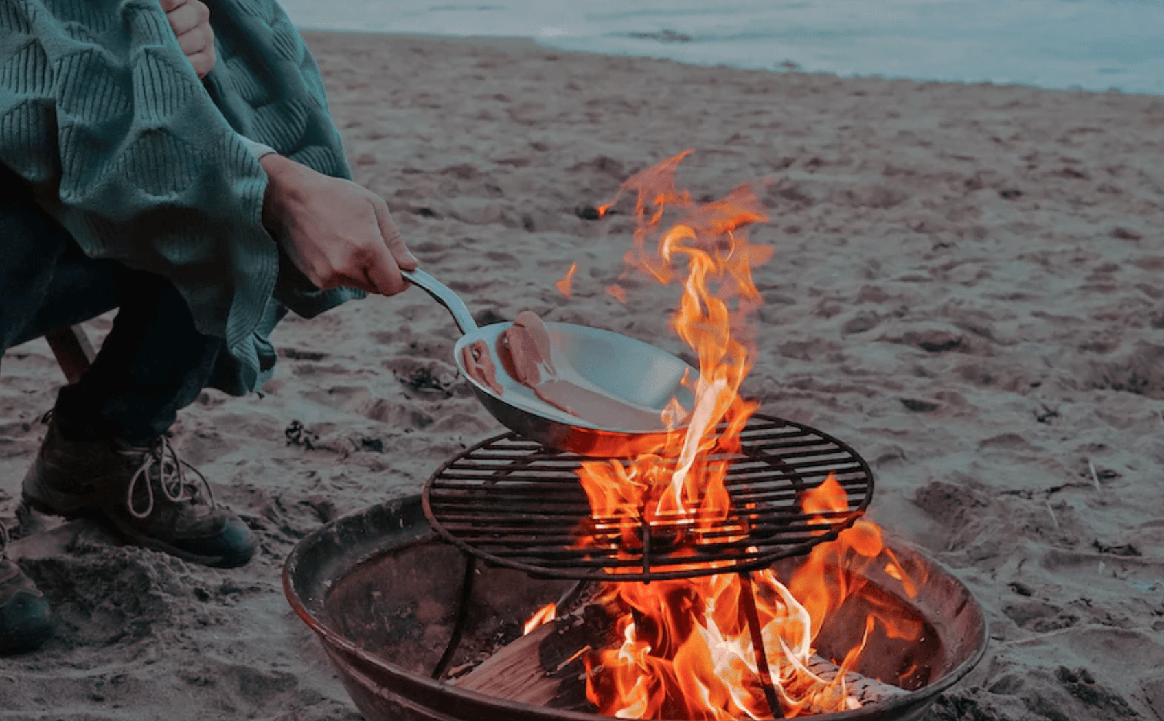 cooking food outdoors on burning wood