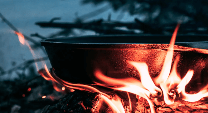 utensil on burning wood
